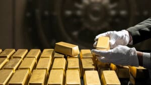 Gold breaks $5,000 an ounce for first time as investors flee to safety
